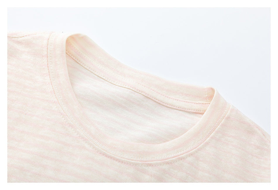 Close-up of a pale pink striped shirt's crew neckline and stitched collar.