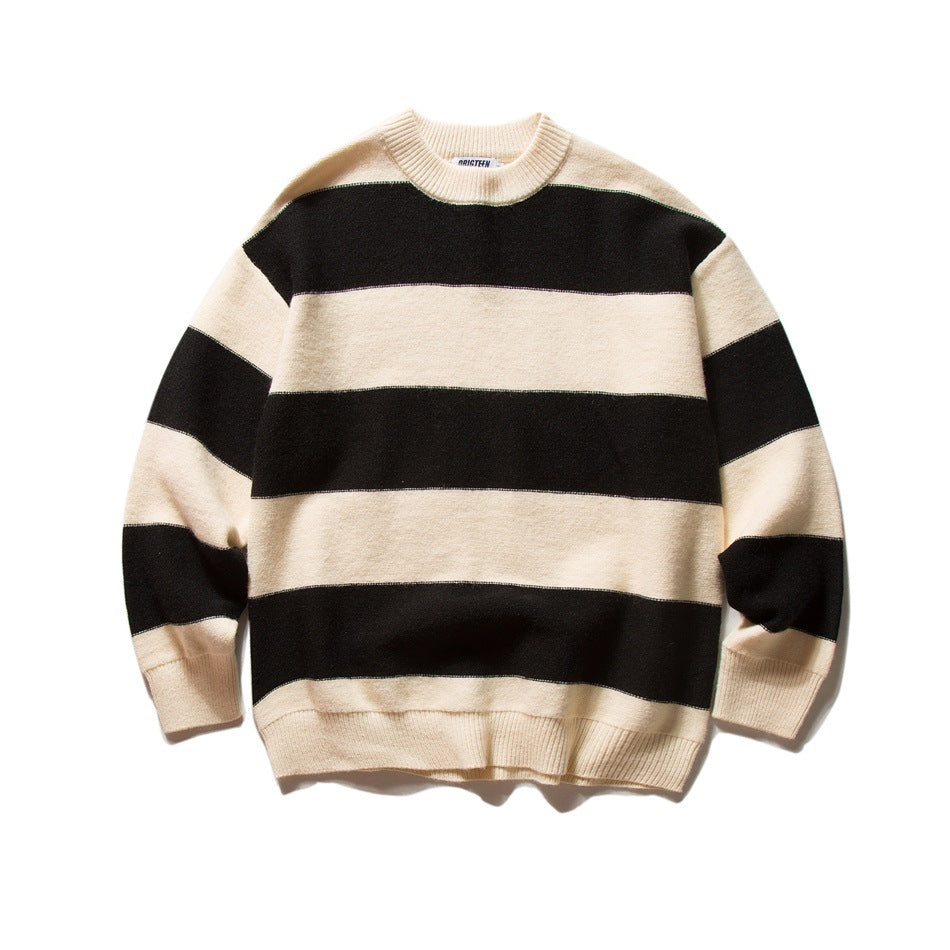 Black and cream wide-striped knit crewneck sweater laid flat, front view