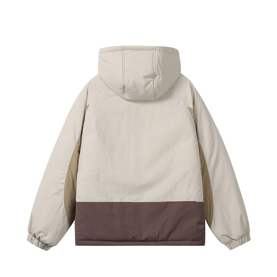 Back view of a cream hooded jacket with tan side panels and a wide dark brown color-block hem.