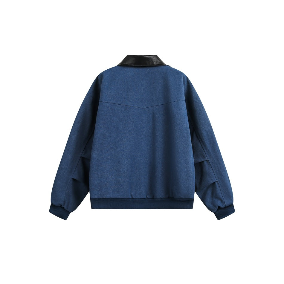 Back view of blue bomber jacket with yoke seam, black collar, ribbed hem and cuffs, and pleated sleeve detail