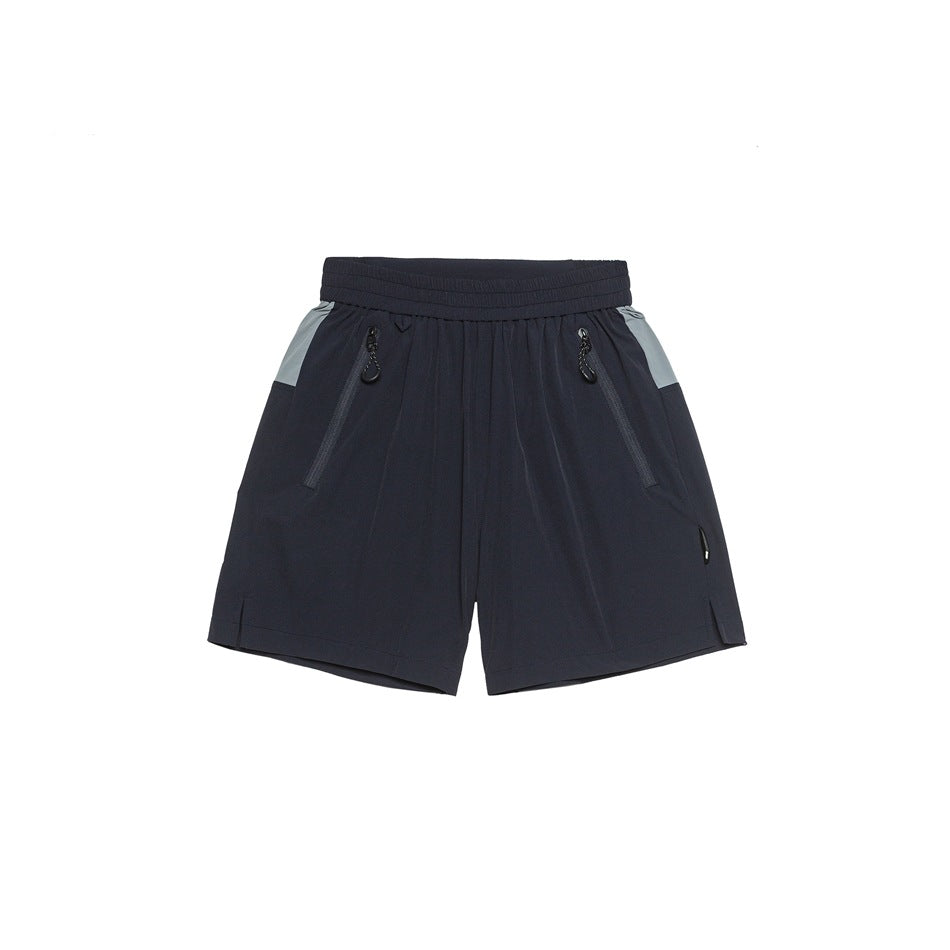 Navy athletic shorts with gray side panels and front zip pockets, flat front view on white background