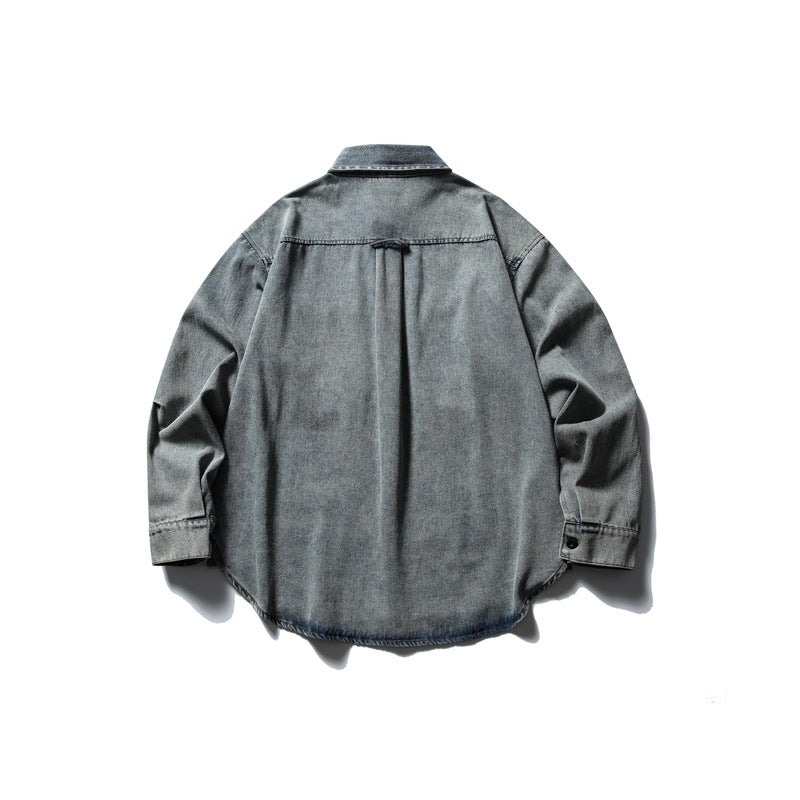 Back view of a gray washed denim shirt with a pointed collar, long sleeves and a curved hem.