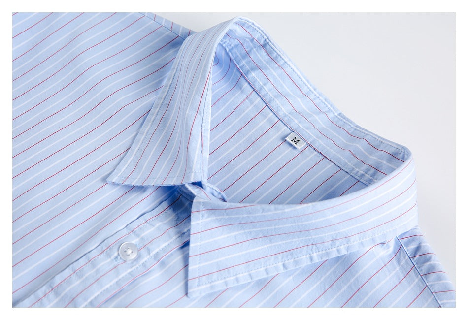 Close-up of a light blue striped shirt with a spread collar and a size M label.