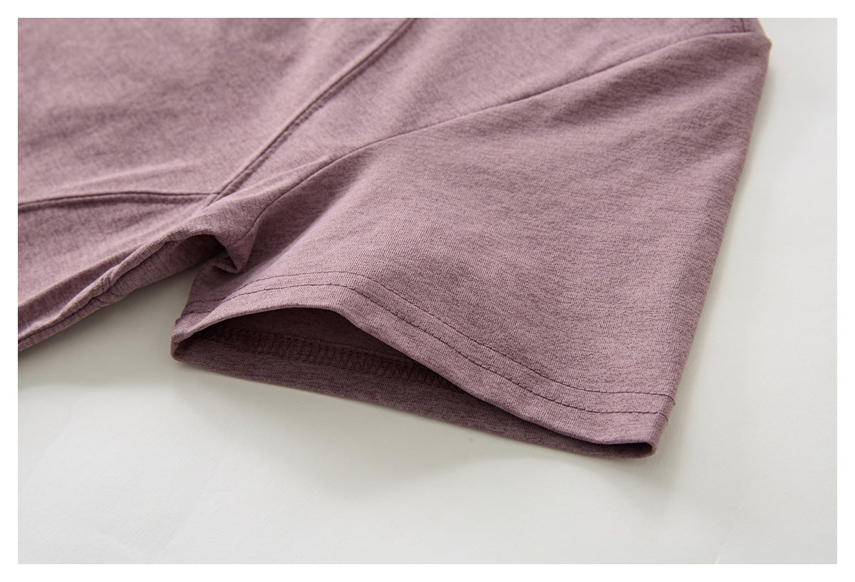 Close-up of the mauve short sleeve and its stitched hem.