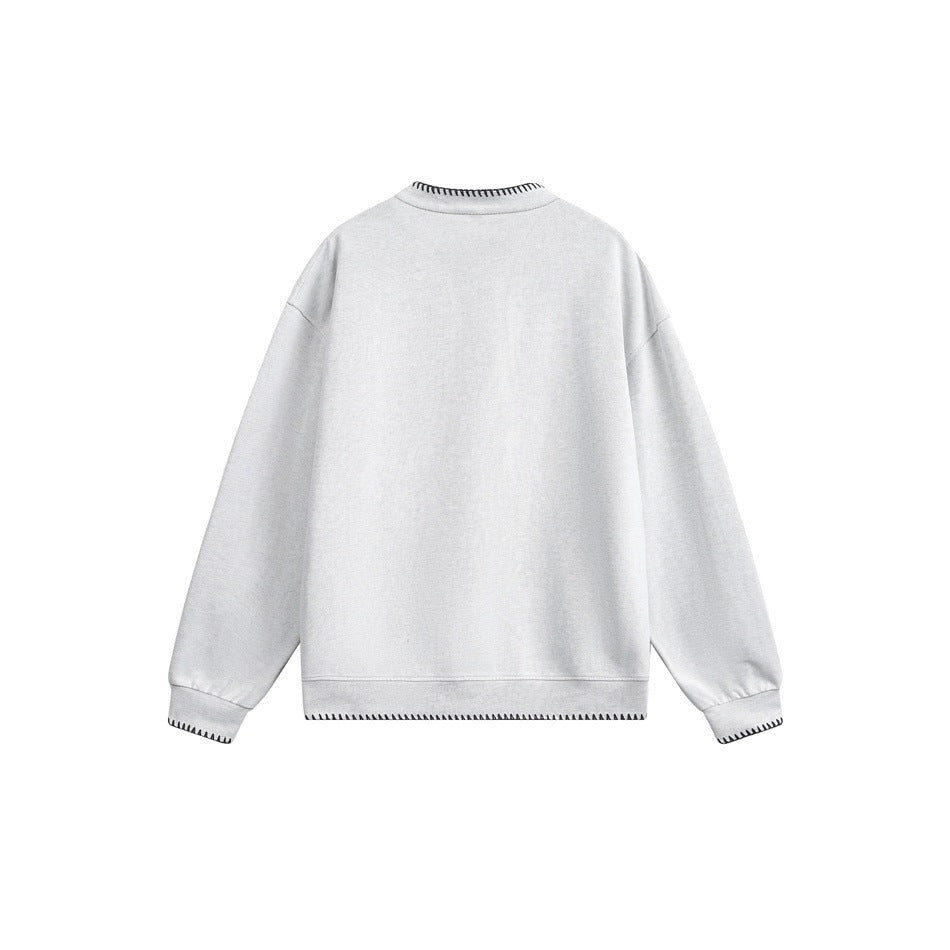 Back view of a pale gray crewneck sweatshirt with black contrast stitching at the collar, cuffs, and hem.