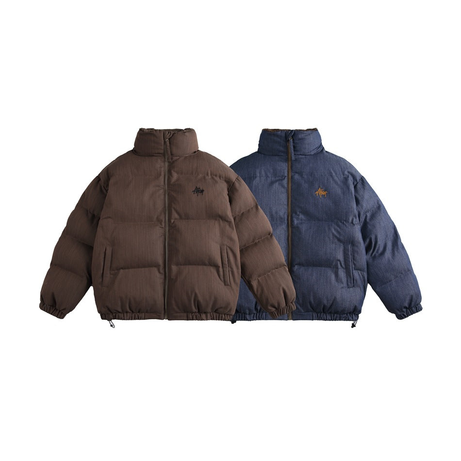 Two front-facing padded jackets with high collars and chest marks, shown in brown and navy.