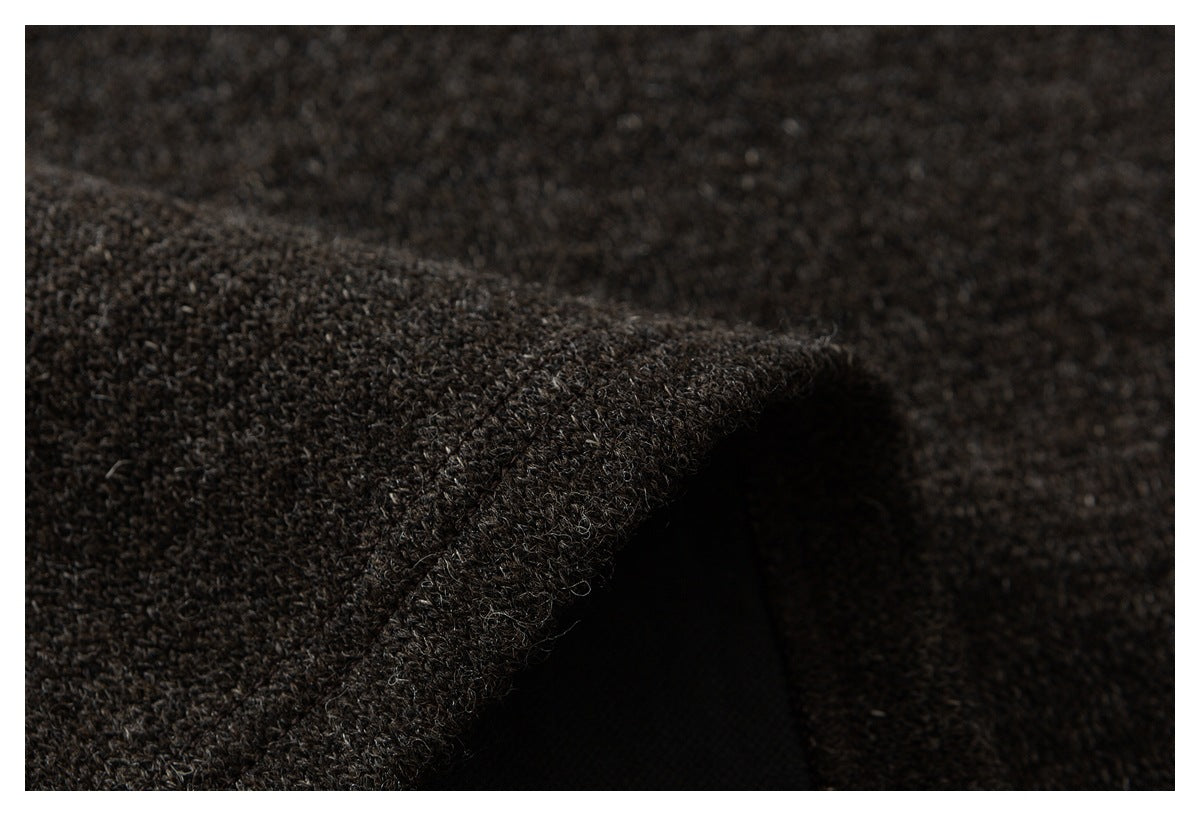 Close-up of a folded edge showing the thick, dark brown flecked fabric and dark inner side.