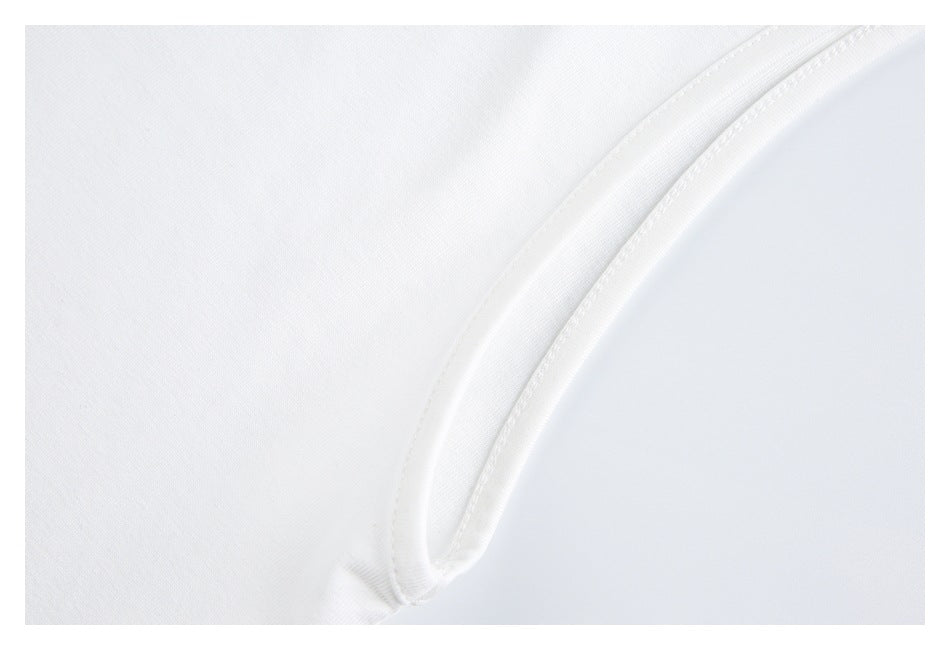 Close-up of a curved seam on white T-shirt fabric.