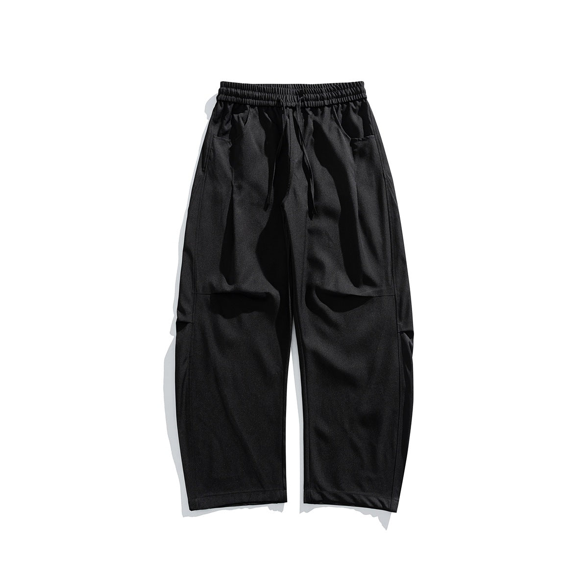 Black wide-leg drawstring trousers with elastic waist and front pockets, flat lay front view