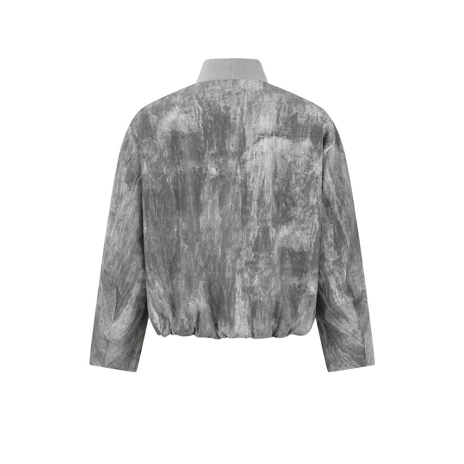 Back view of a gray mottled jacket with a stand collar, long sleeves and gathered hem.