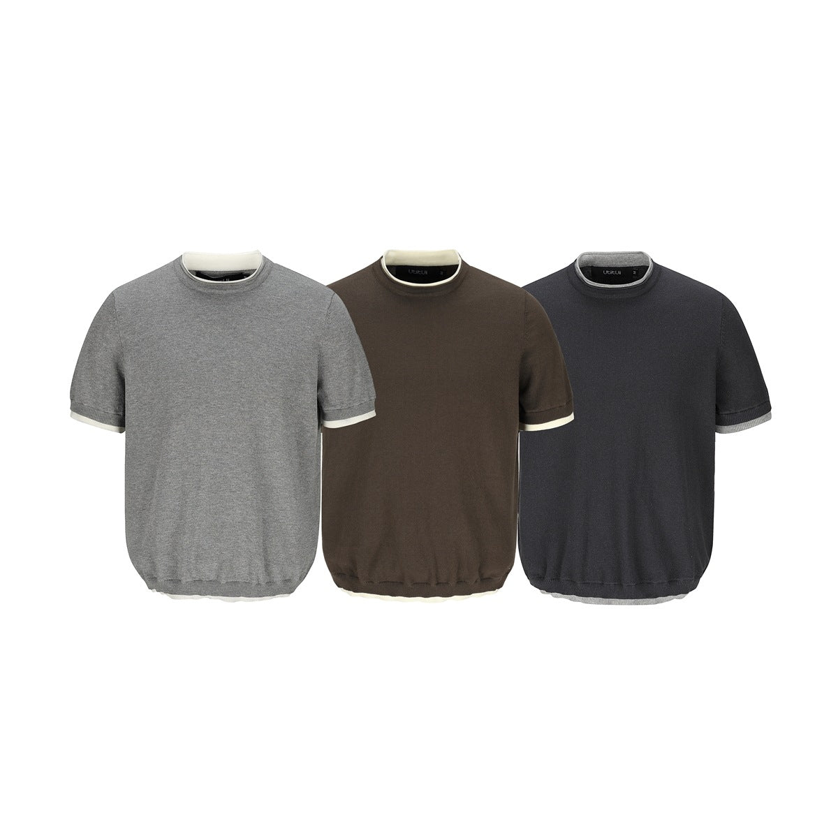 Three short-sleeve knit shirts shown from the front in gray, brown, and dark charcoal, with contrast trim.