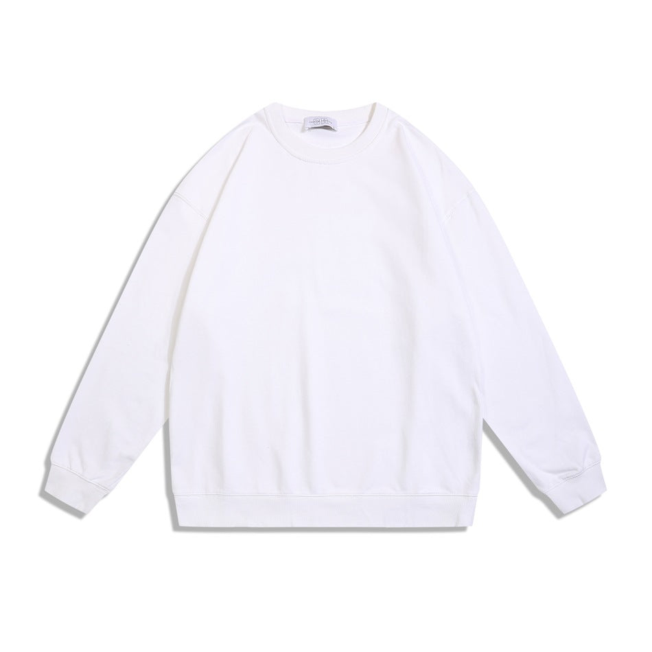 White crewneck sweatshirt flat lay, front view, with ribbed collar, cuffs and hem