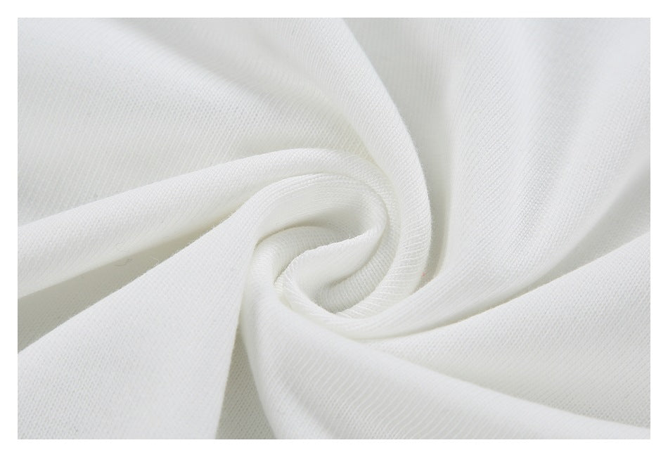 Close-up of white fabric twisted into a swirl, showing its fine knit texture.