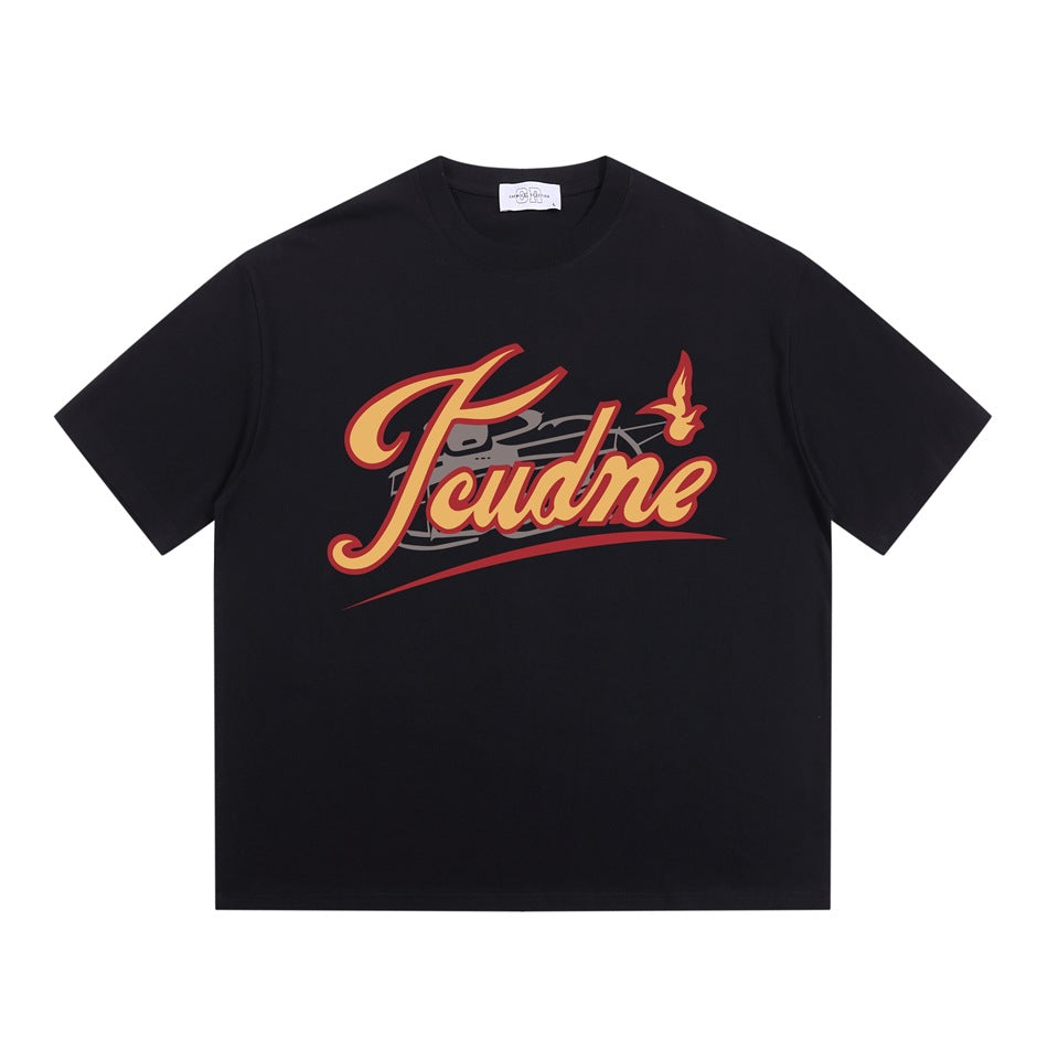 Black crew neck T-shirt flat lay with yellow and red retro script graphic on the chest