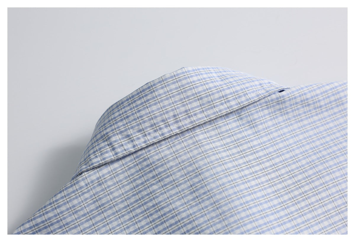 Close-up of the collar on a blue-and-white checked shirt.