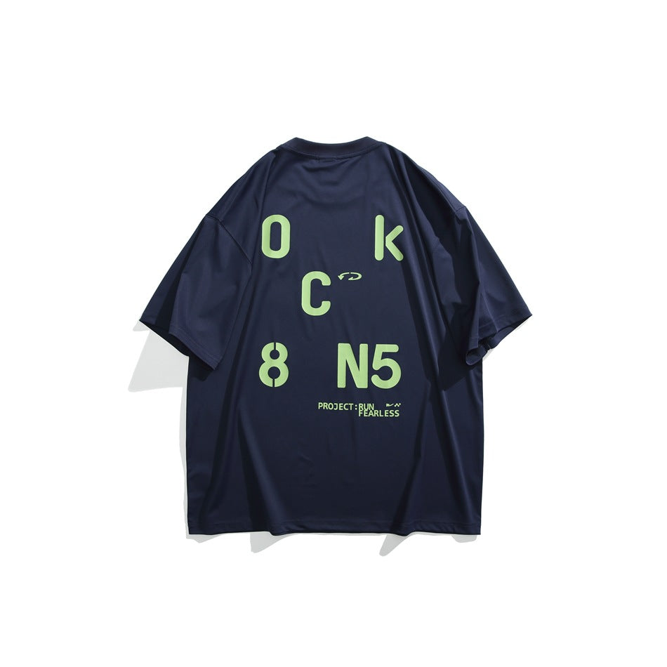 Back of navy short-sleeve T-shirt with large bright green stencil letter and number graphic