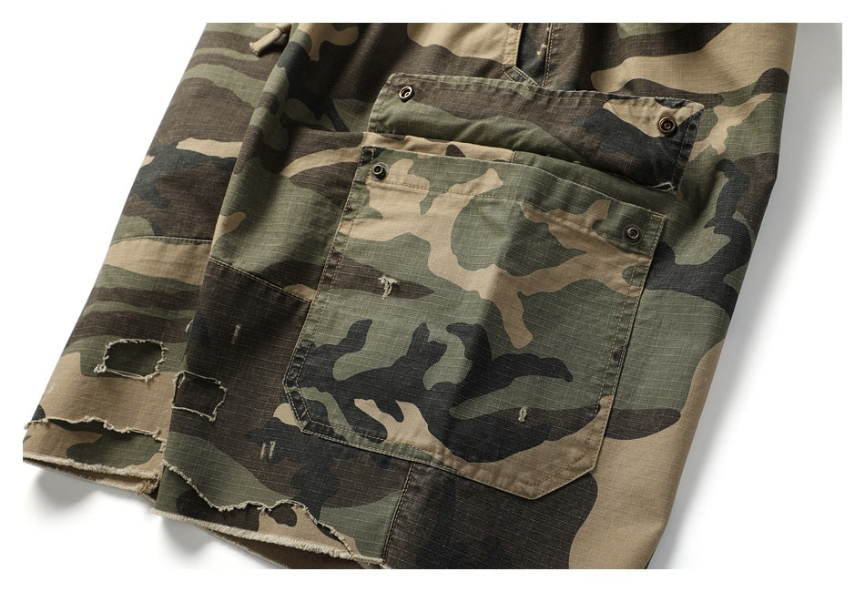 Close-up of a large camouflage cargo pocket, metal eyelets, and distressed, frayed hems.