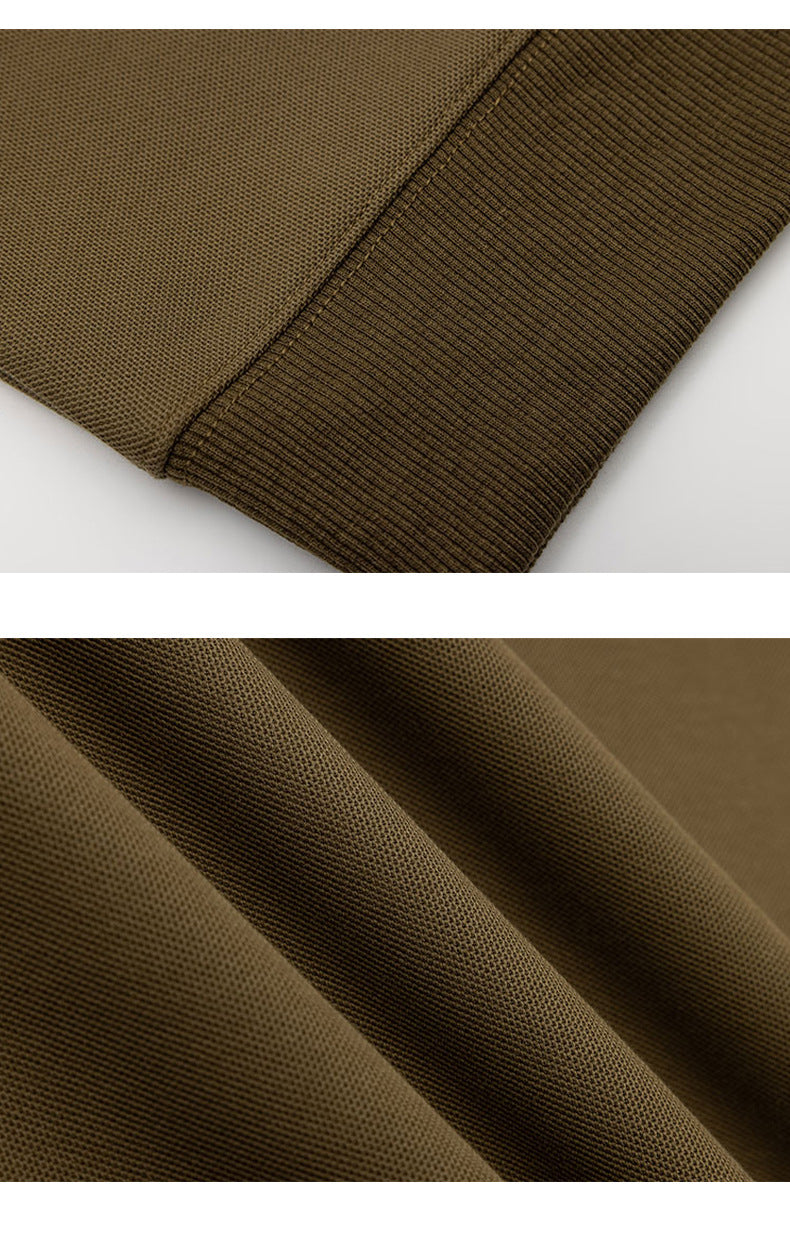 Close-ups of the olive-brown sweatshirt's ribbed hem and textured fabric.