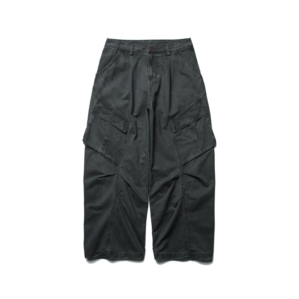 Dark gray wide-leg cargo pants with large flap pockets and curved leg seams, flat lay front view