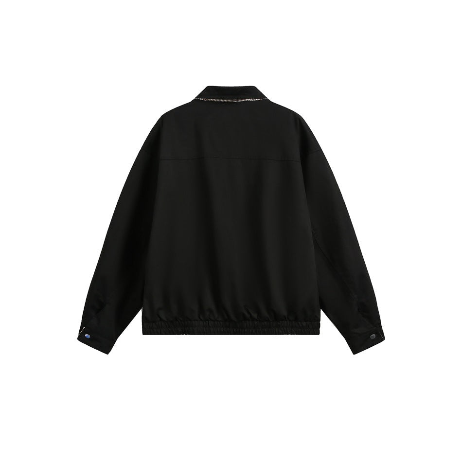 Back view of a black jacket with a check lining detail at the collar and an elastic hem.
