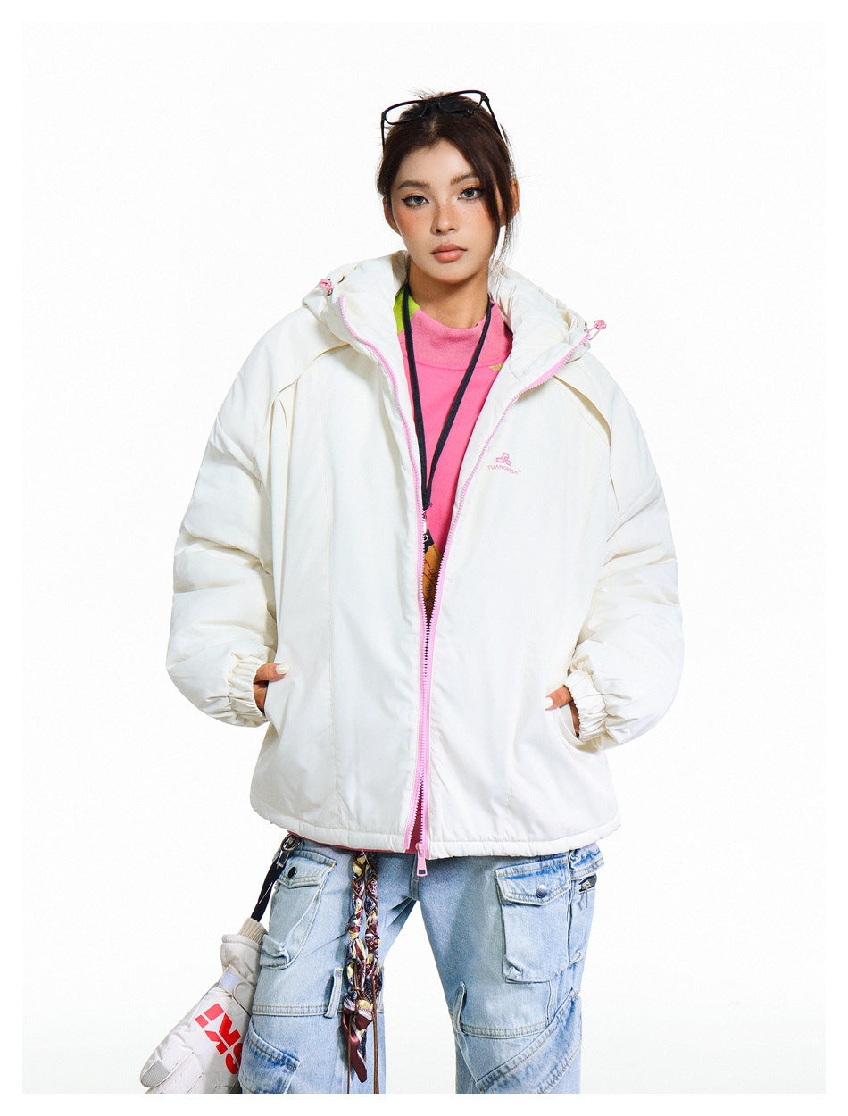 Model wearing a white hooded jacket with pale pink zipper trim, open over a bright pink top.
