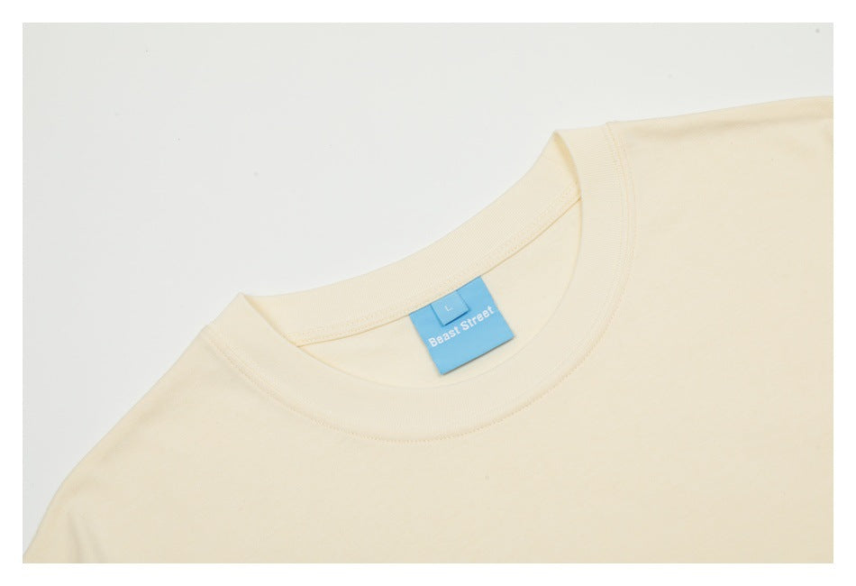 Close-up of the off-white T-shirt's crew neck with a blue Beast Street size L label.