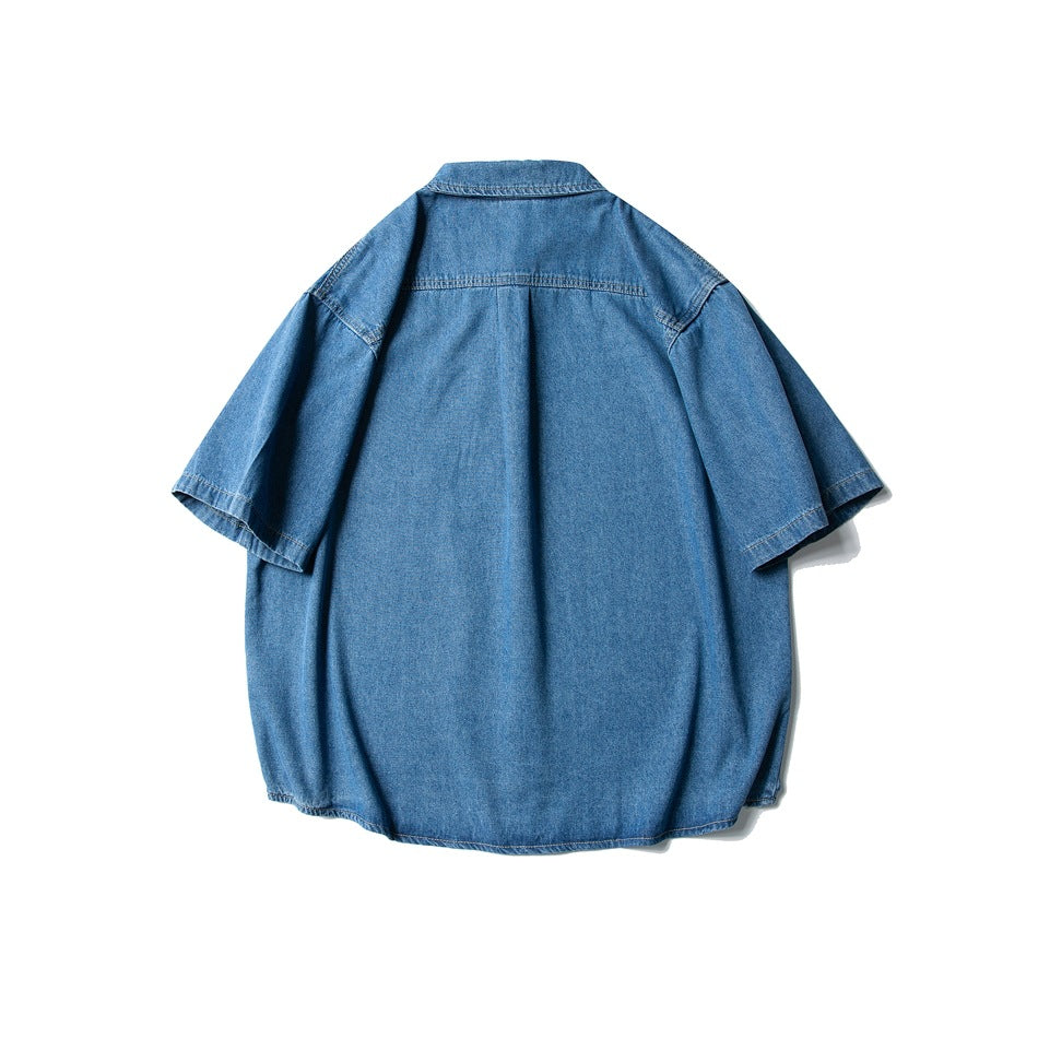 Back view of washed blue short-sleeve denim-look shirt showing yoke seam and plain back panel
