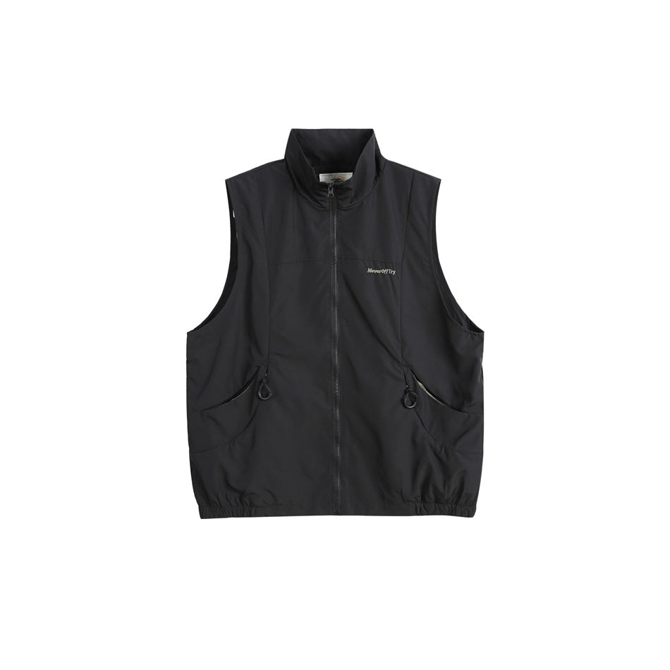Black sleeveless stand-collar zip vest with curved front pockets and elasticated hem, flat front view