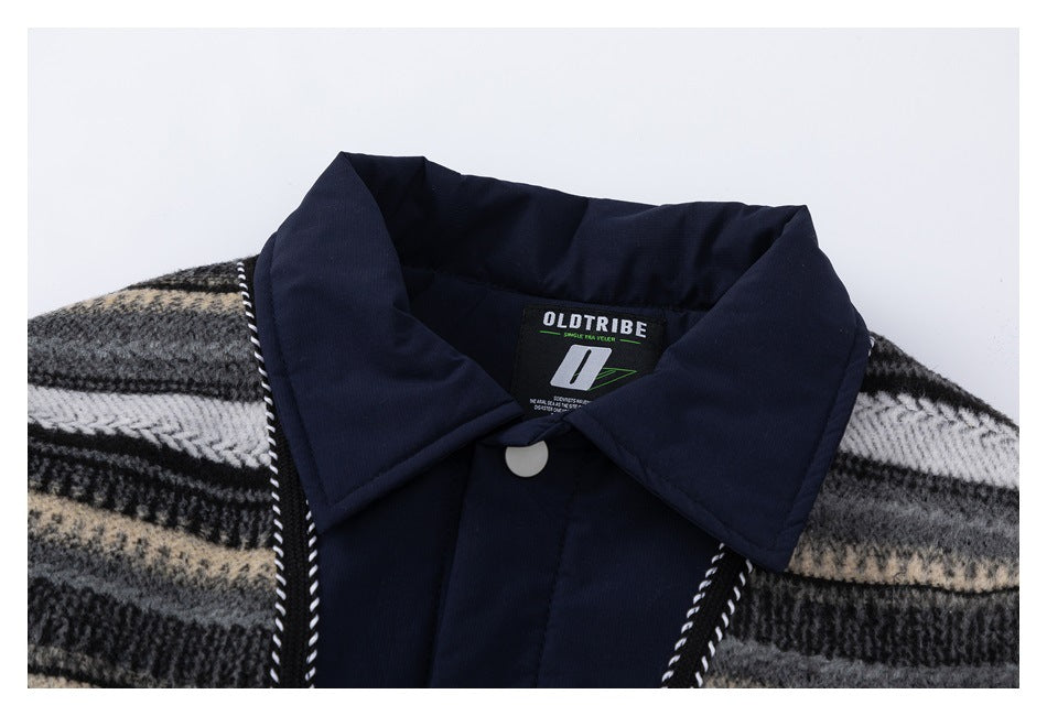 Close-up of the navy collar and front of a black, gray, and cream plaid garment.