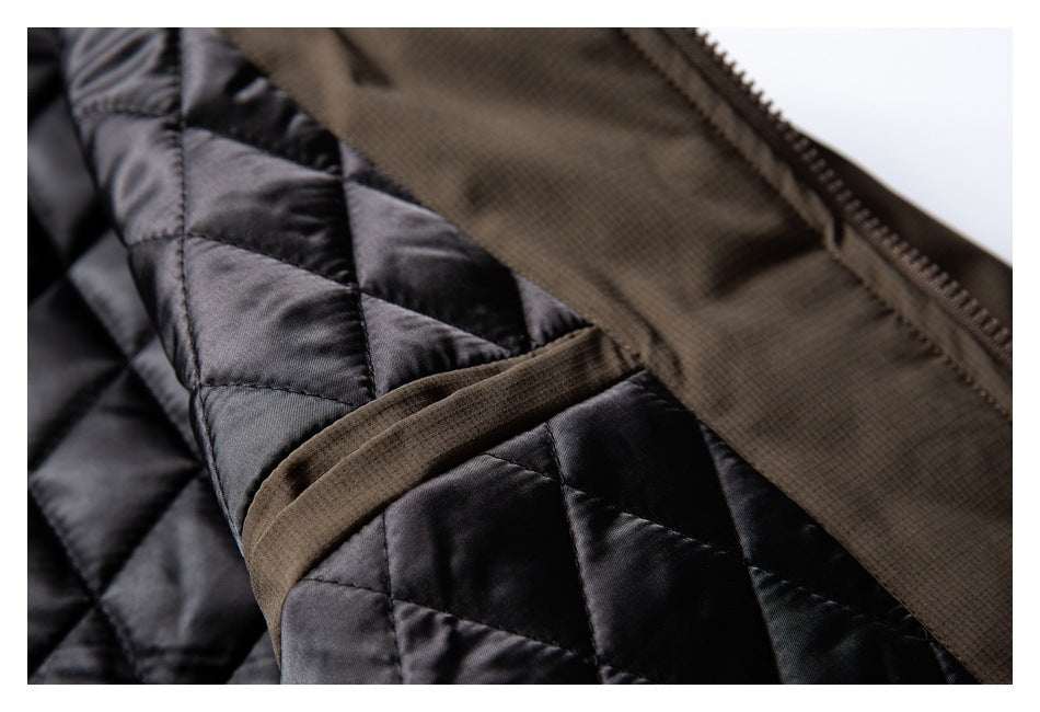 Open brown jacket showing its black diamond-quilted lining and zipper.