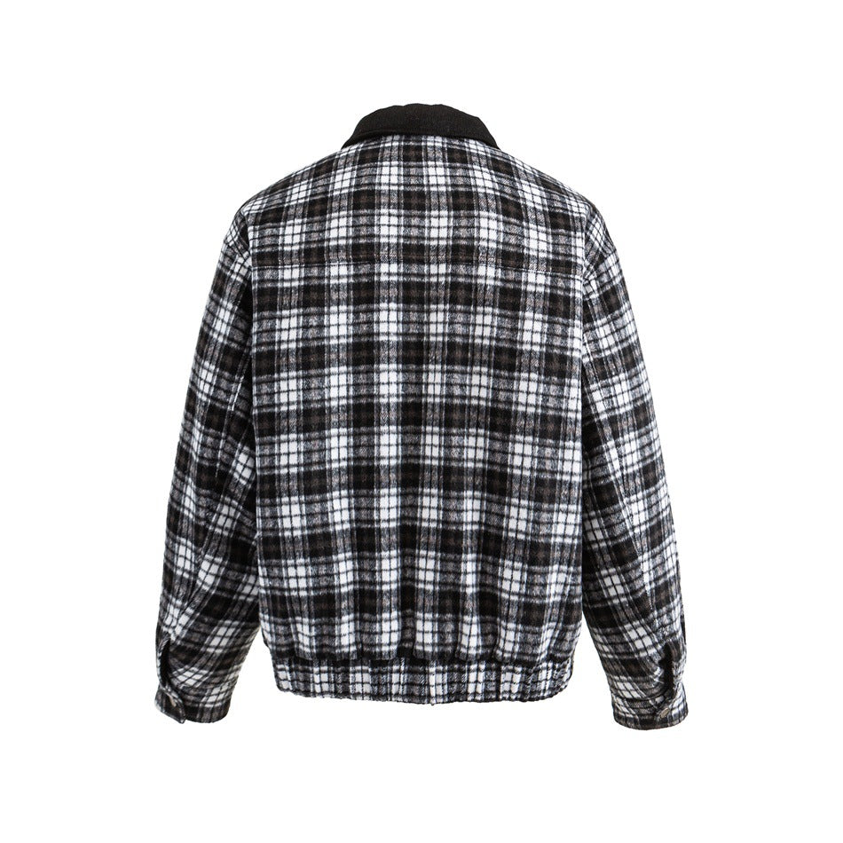 Back view of black and white plaid jacket with black collar, elastic ribbed hem and button cuff tabs