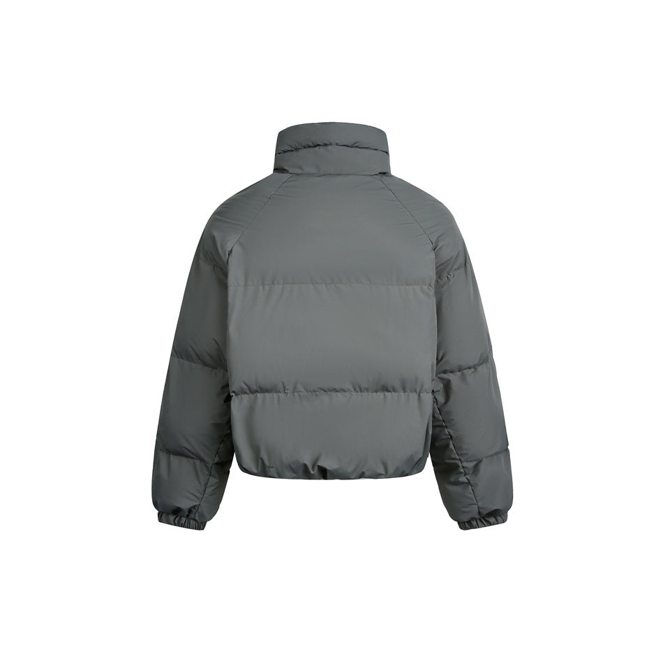 Back view of a charcoal-gray cropped puffer jacket with a high collar, raglan sleeves, and elastic cuffs.