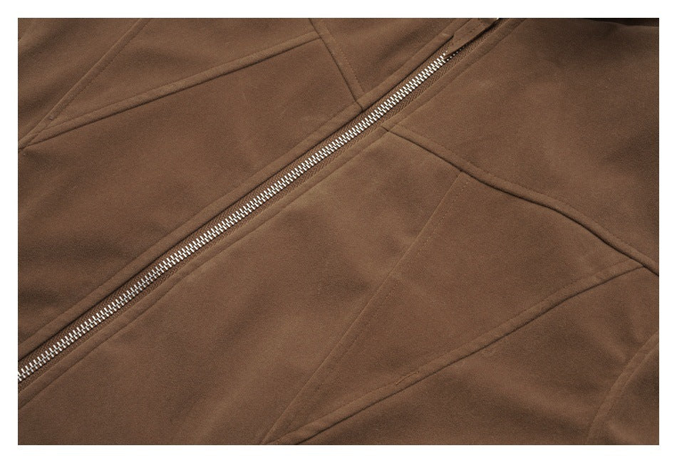 Close-up of brown jacket panels and a diagonal silver zipper with visible stitching.
