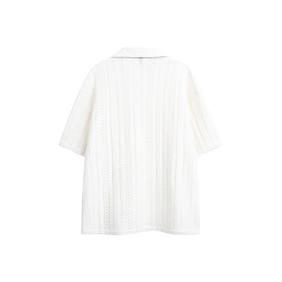 Back view of a white short-sleeve button-up shirt with a wide collar and vertical openwork stripes.