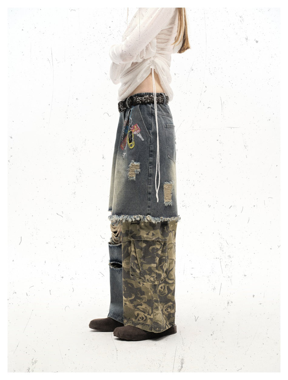 Side view of a model in wide-leg patchwork jeans with a frayed seam, camouflage cargo pocket and studded belt