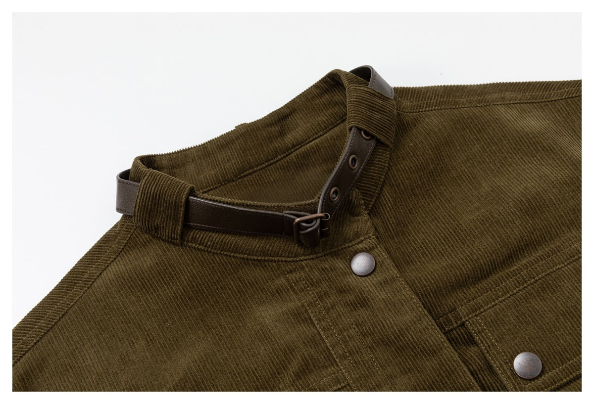 Close-up of the jacket's olive corduroy collar, brown adjustable neck strap and metal snap closure.