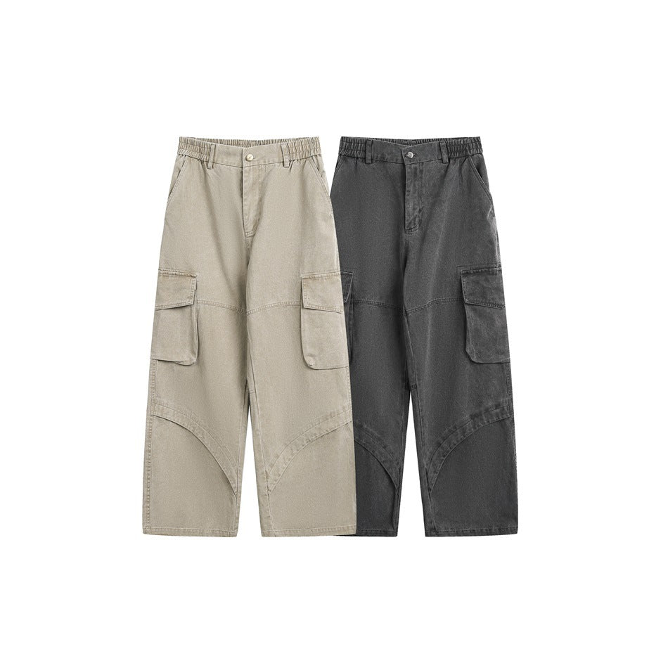 Front view of wide-leg cargo pants in light beige and charcoal, each with an elasticized waist and large flap pockets.