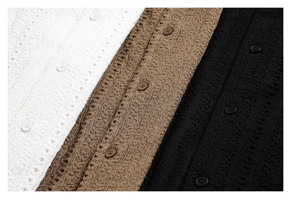 Close view of three button-front textured garments in white, tan, and black.