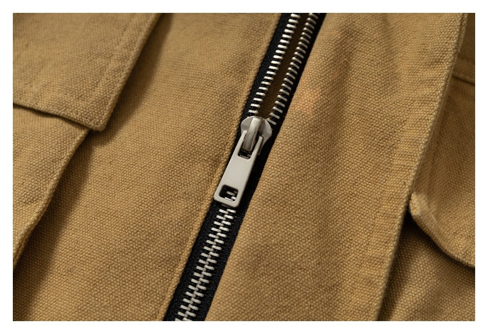Close-up of the jacket’s black zipper tape, silver zipper teeth, and metal slider.