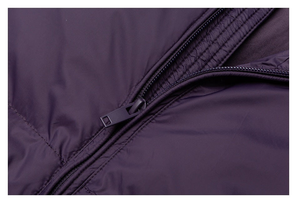 Close-up of a black zipper and stitching on the purple jacket.
