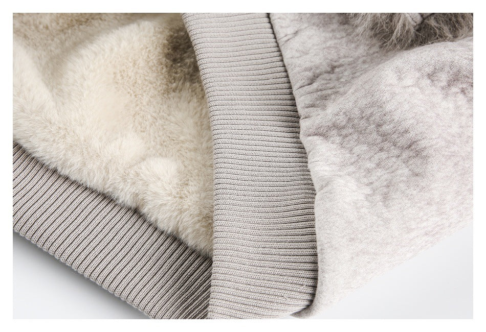 Close-up of the jacket's soft cream lining and wide taupe ribbed hem.