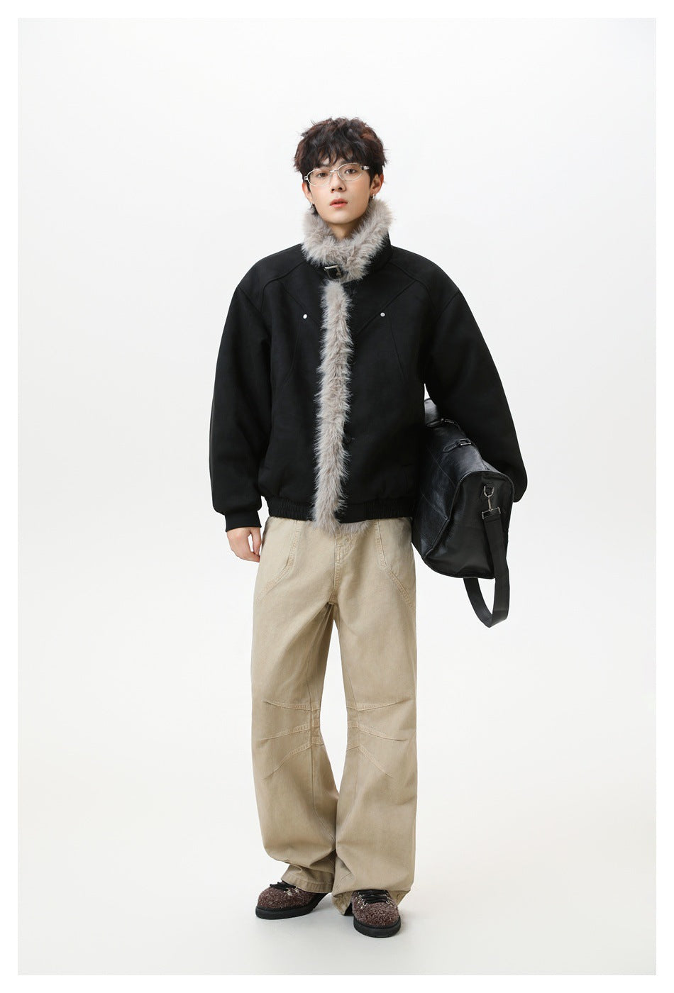 Full-length model wearing a black jacket with gray fur trim at the collar and front.