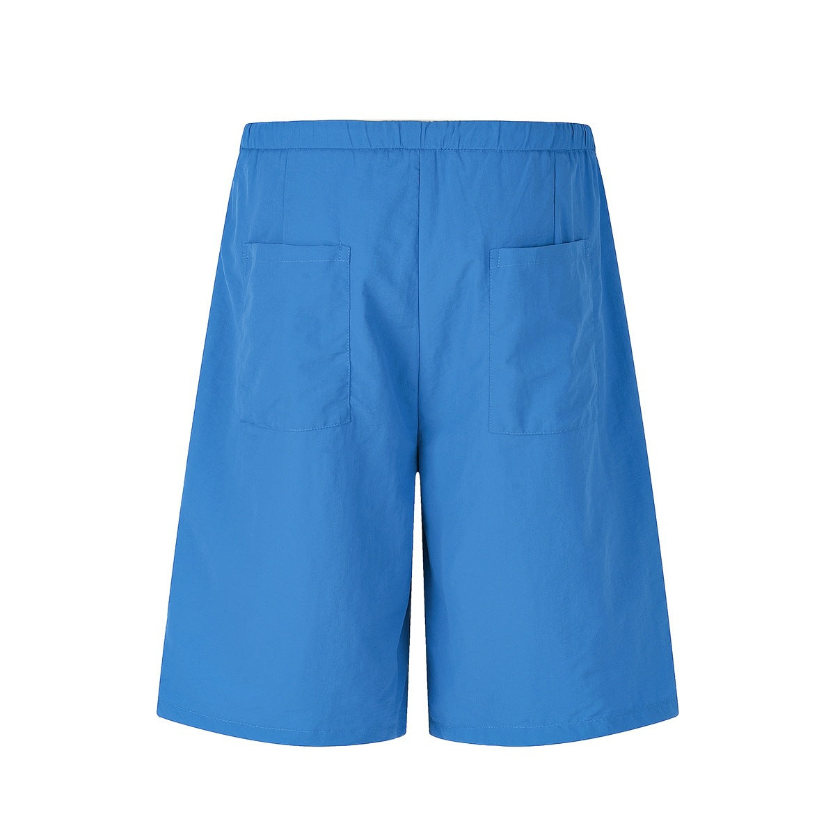 Back view of bright blue, wide-leg shorts with an elastic waistband and two patch pockets.