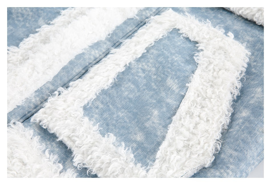 Close-up of a patch pocket outlined with thick white curly fleece on the blue jacket.