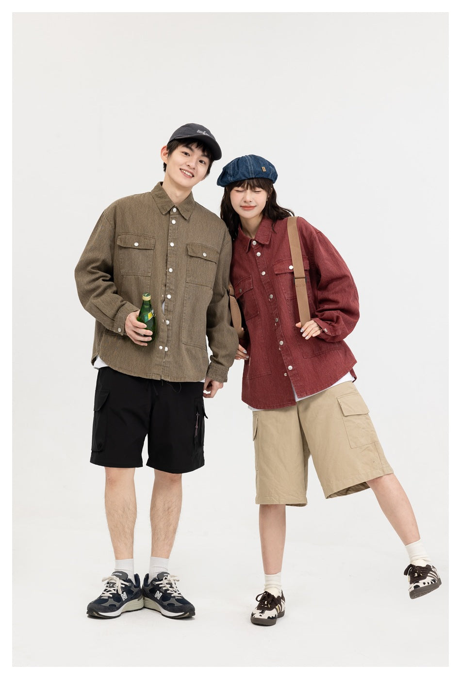 Two models wear olive and burgundy button-front shirts with chest and lower pockets, paired with cargo shorts.