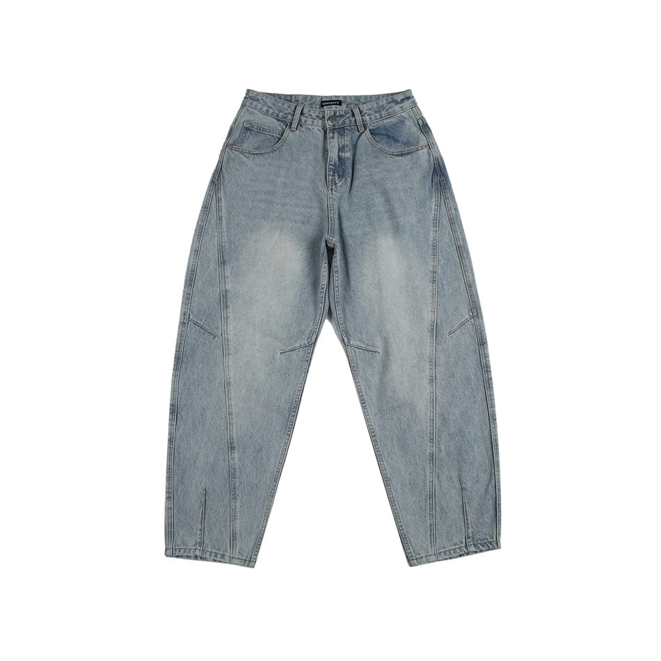Front view of light-blue washed denim jeans with curved side seams and a tapered leg on a white background