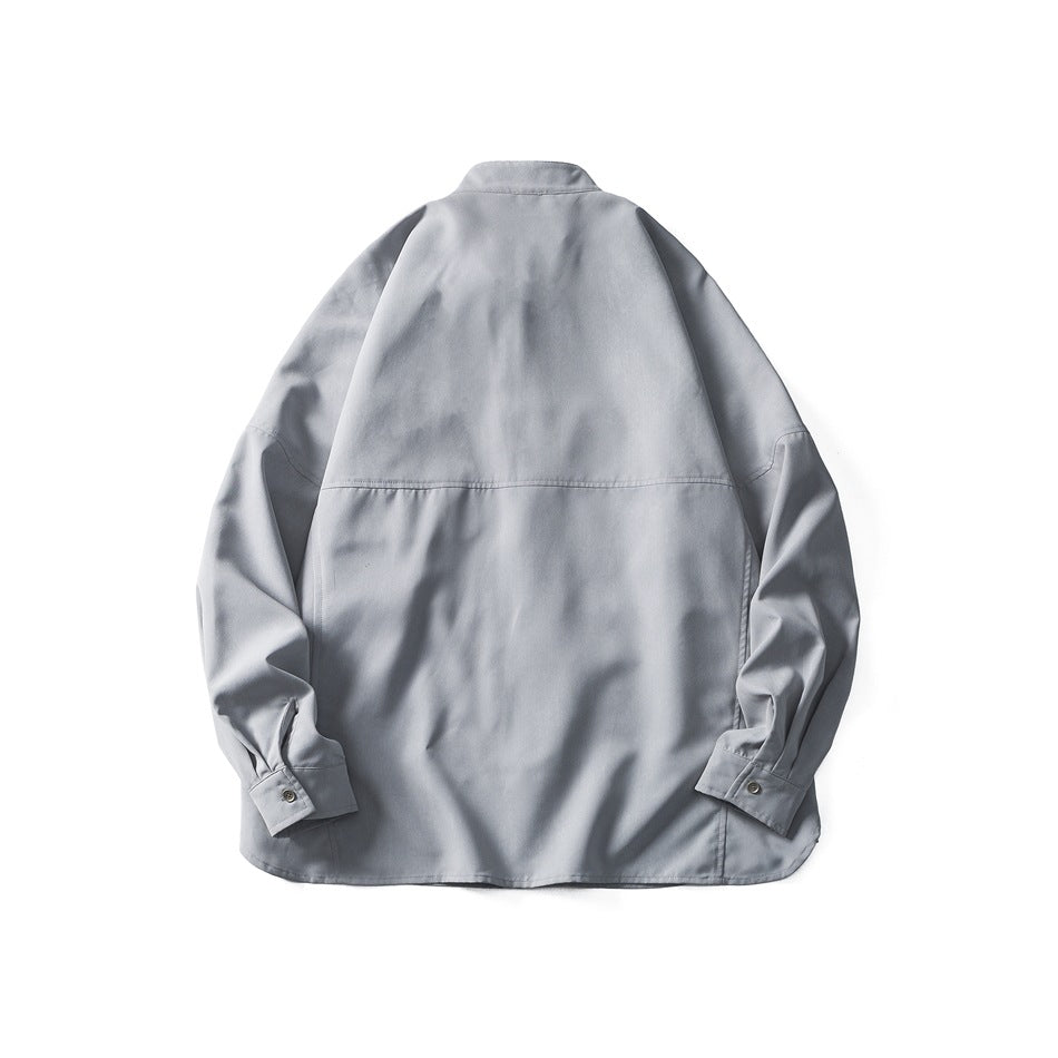 Back view of a light gray shirt laid flat, showing its stand collar, seam across the back, and button cuffs.