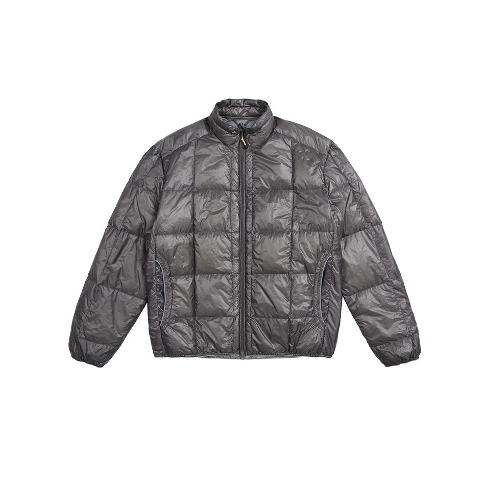 Dark gray quilted puffer jacket with stand collar and front zipper, flat front view