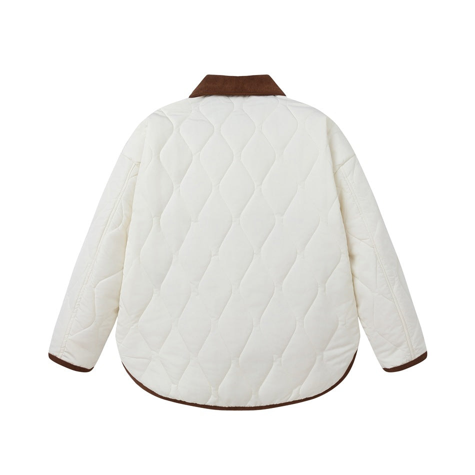 Back of an ivory quilted jacket with a brown collar and brown trim at the cuffs and hem.