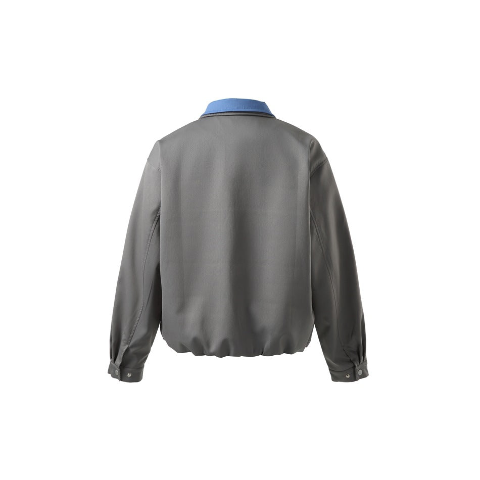 Back view of a gray zip jacket with a blue collar and snap-tab cuffs.